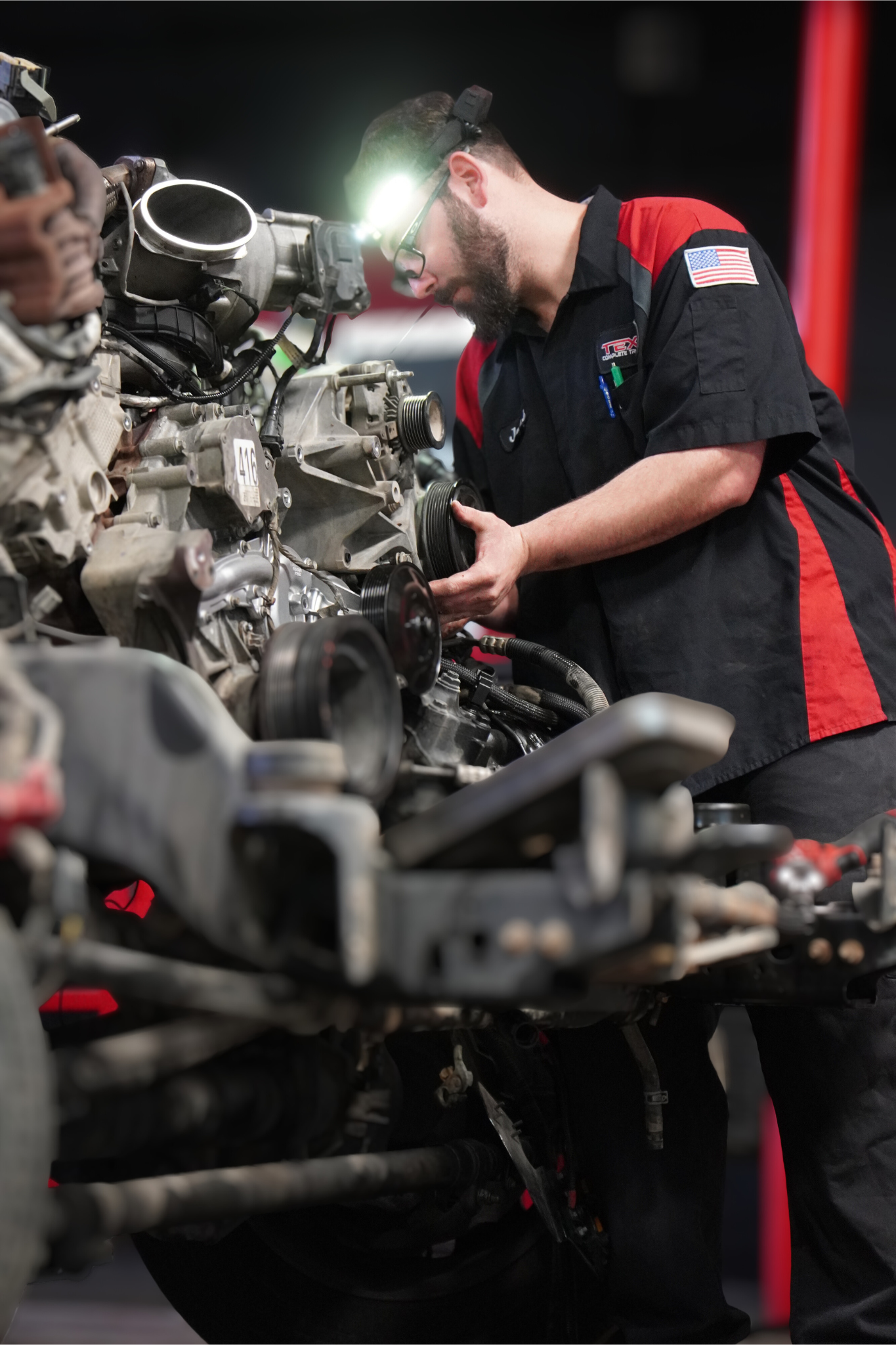 Custom truck chassis build with Texas Complete Truck Center employee performing assembly in New Braunfels, Texas